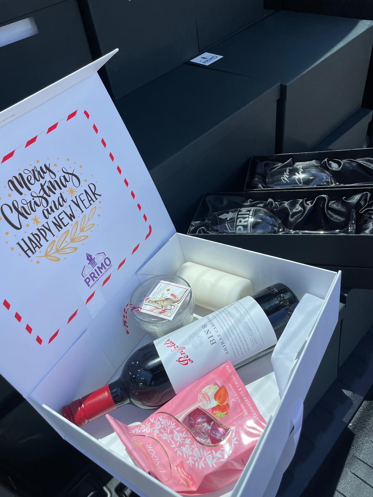 Custom Christmas hamper box with wine, candle and engraved glasses