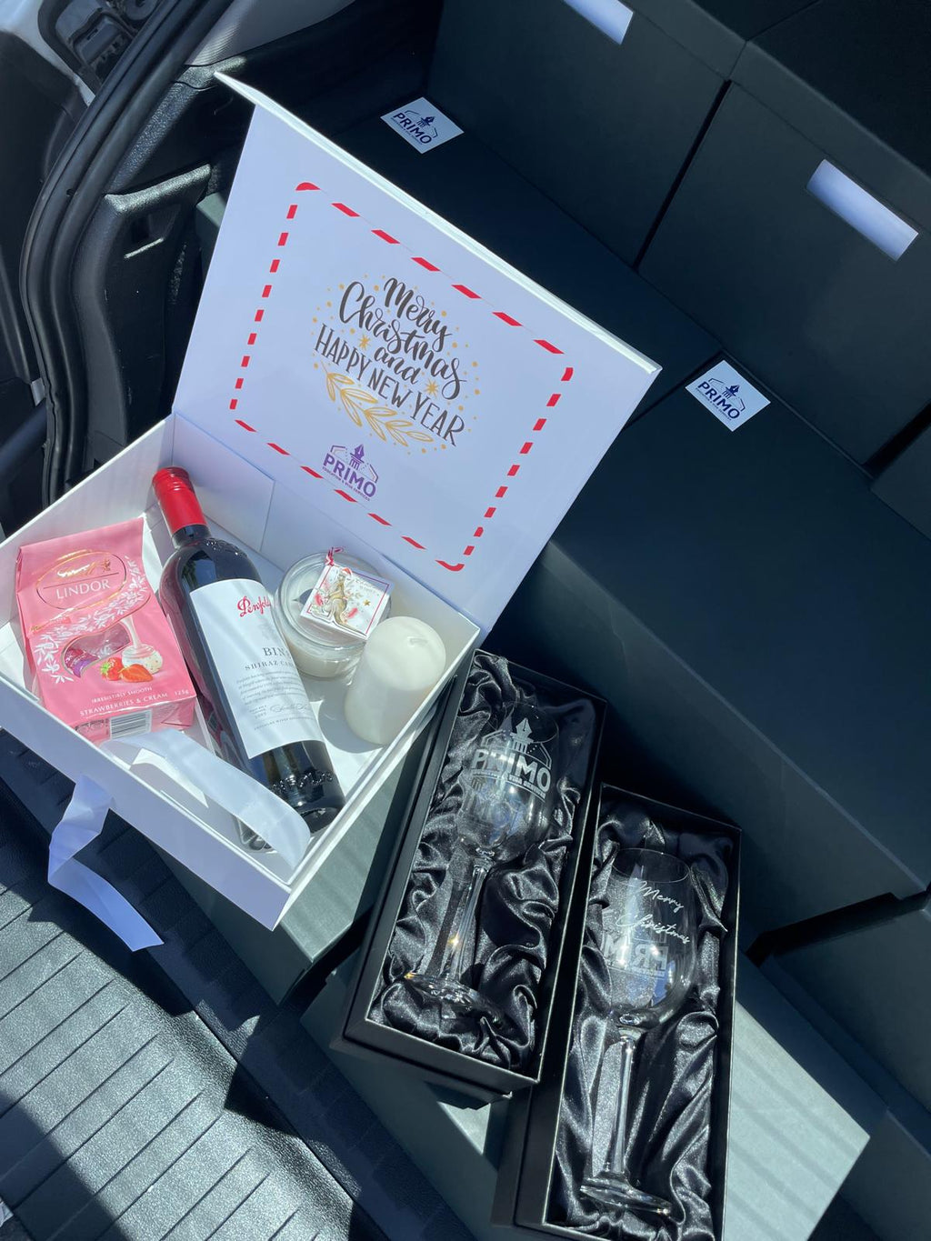 Premium branded gift box with two engraved wine glasses in satin boxes