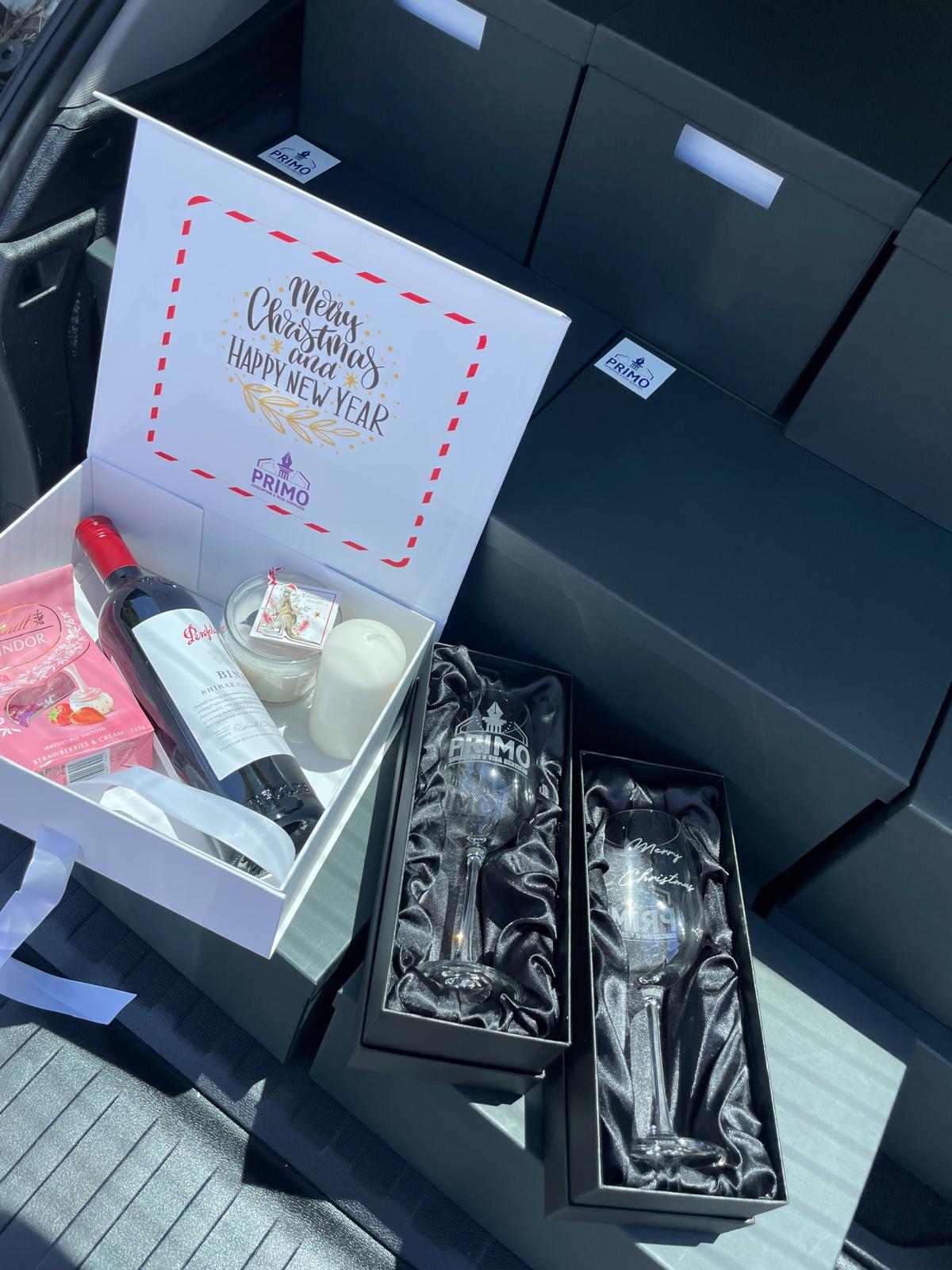 Branded gift box with wine, candle and engraved glassware